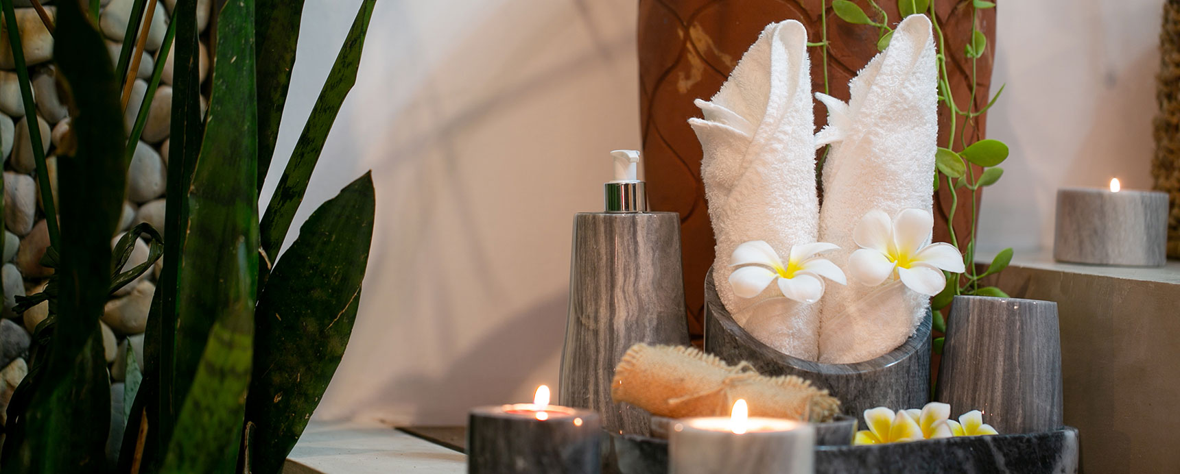 Bathroom amenities with frangipani and candles — open-sky private villa bedroom bathroom, Kawayan Villa Siargao