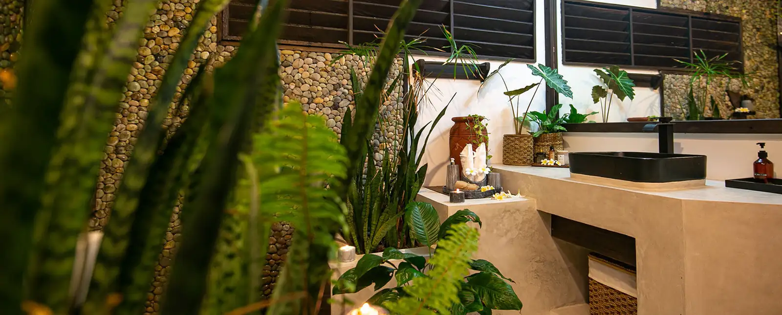 Open-sky bathroom vanity with tropical plants — private villa bedroom, Kawayan Villa Siargao