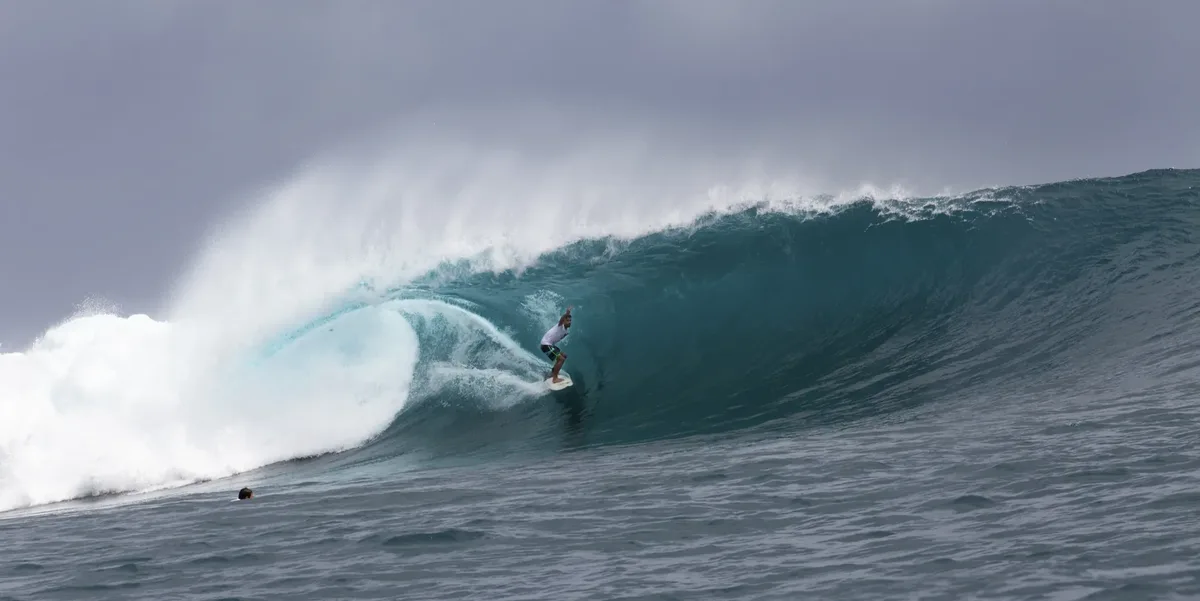 Stimpy's left — a powerful reef break on the far side of the bay from Cloud 9, Siargao — with David Frachou in the barrel