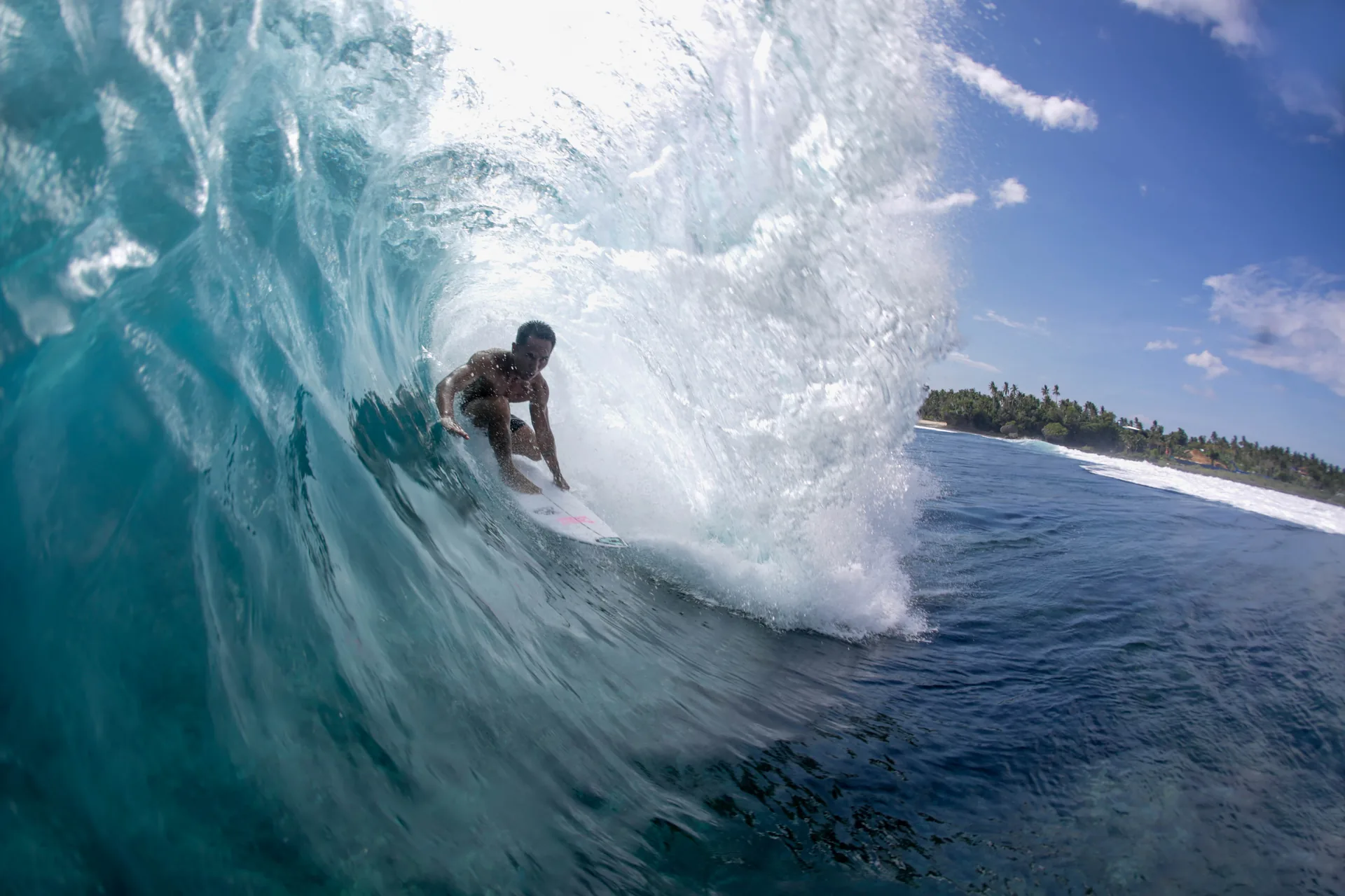 Surfer in a clean Cloud 9 barrel, General Luna, Siargao