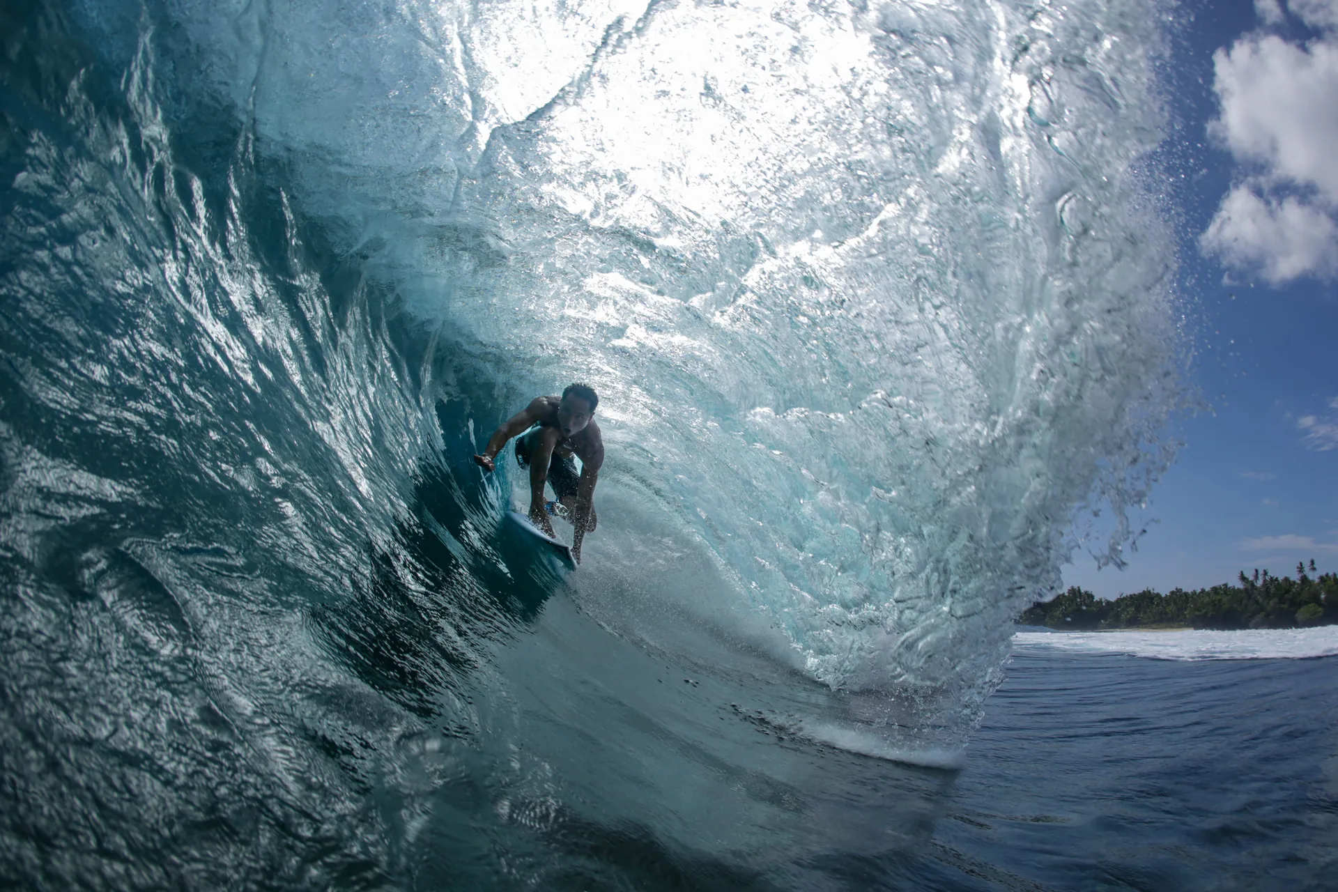 Surfer tucked into a Cloud 9 barrel, Siargao Island