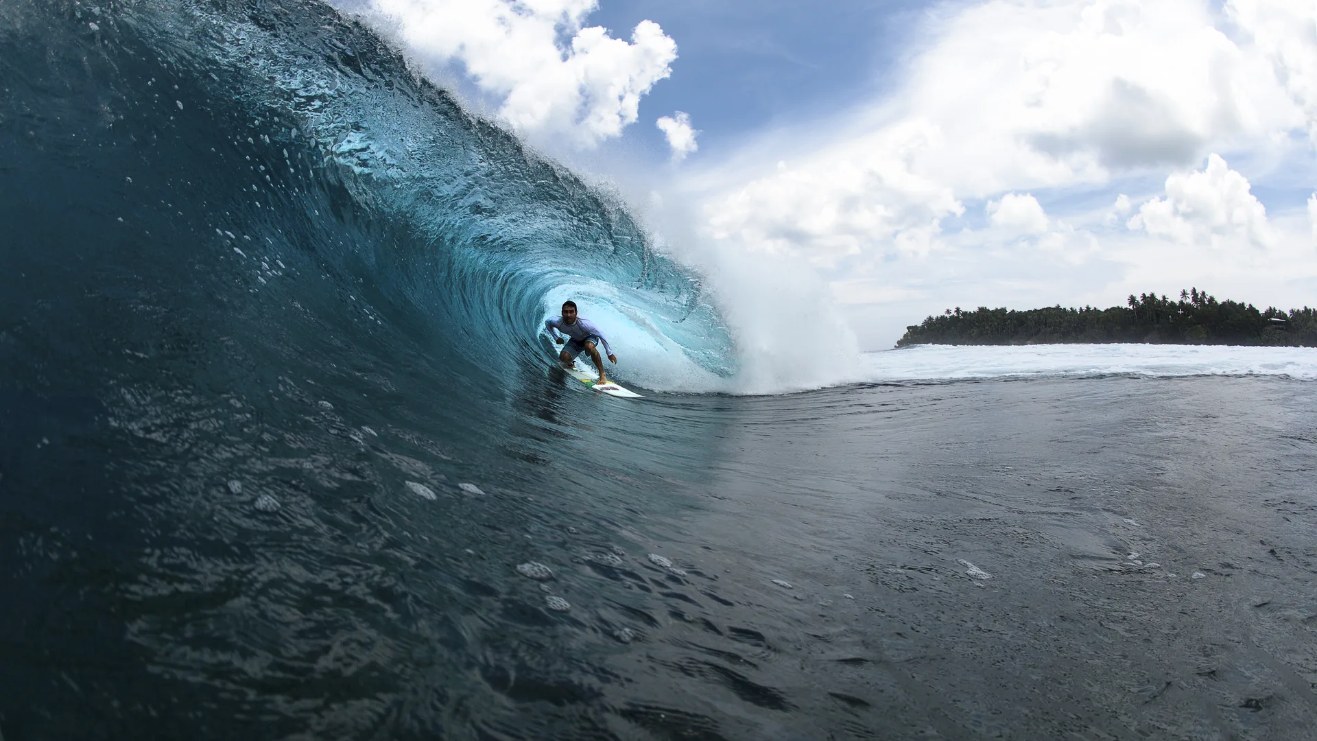 Wide view of the Cloud 9 wave breaking over the reef, Siargao